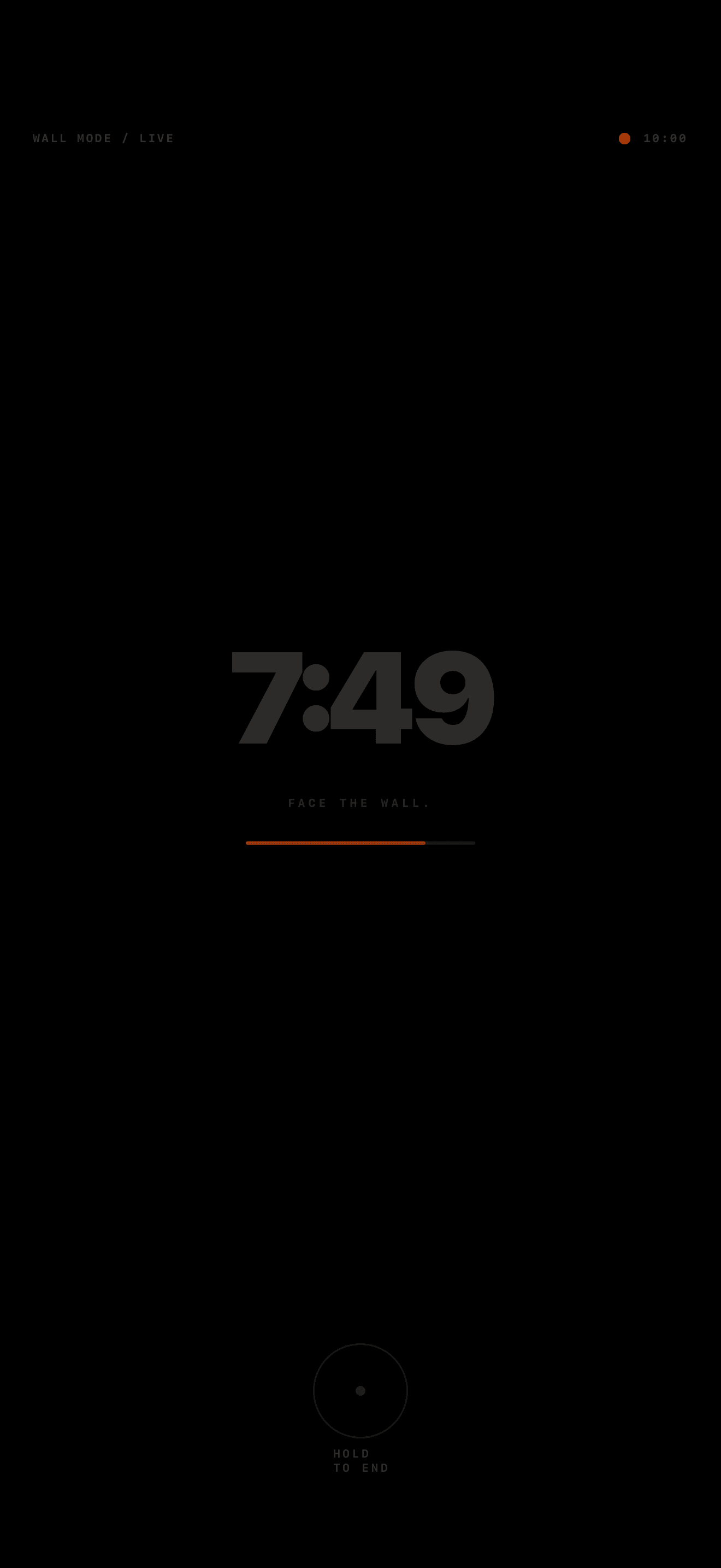 WallTime's dark Wall Mode with a deliberately faint timer and hold-to-end control.